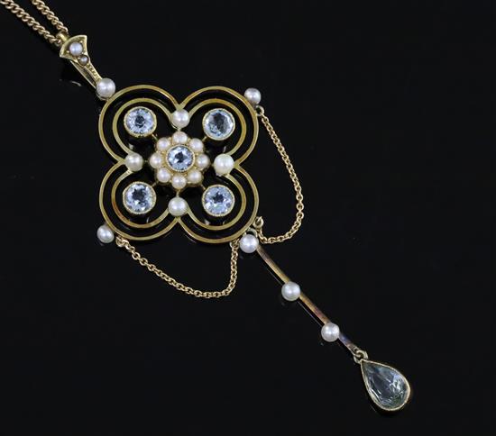 A late Victorian 15ct gold, aquamarine and seed pearl set drop pendant, on a 15ct gold fine link chain, pendant 71mm inc. bale.